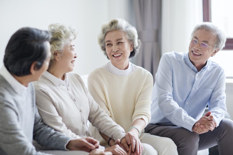 Happy senior friends talking