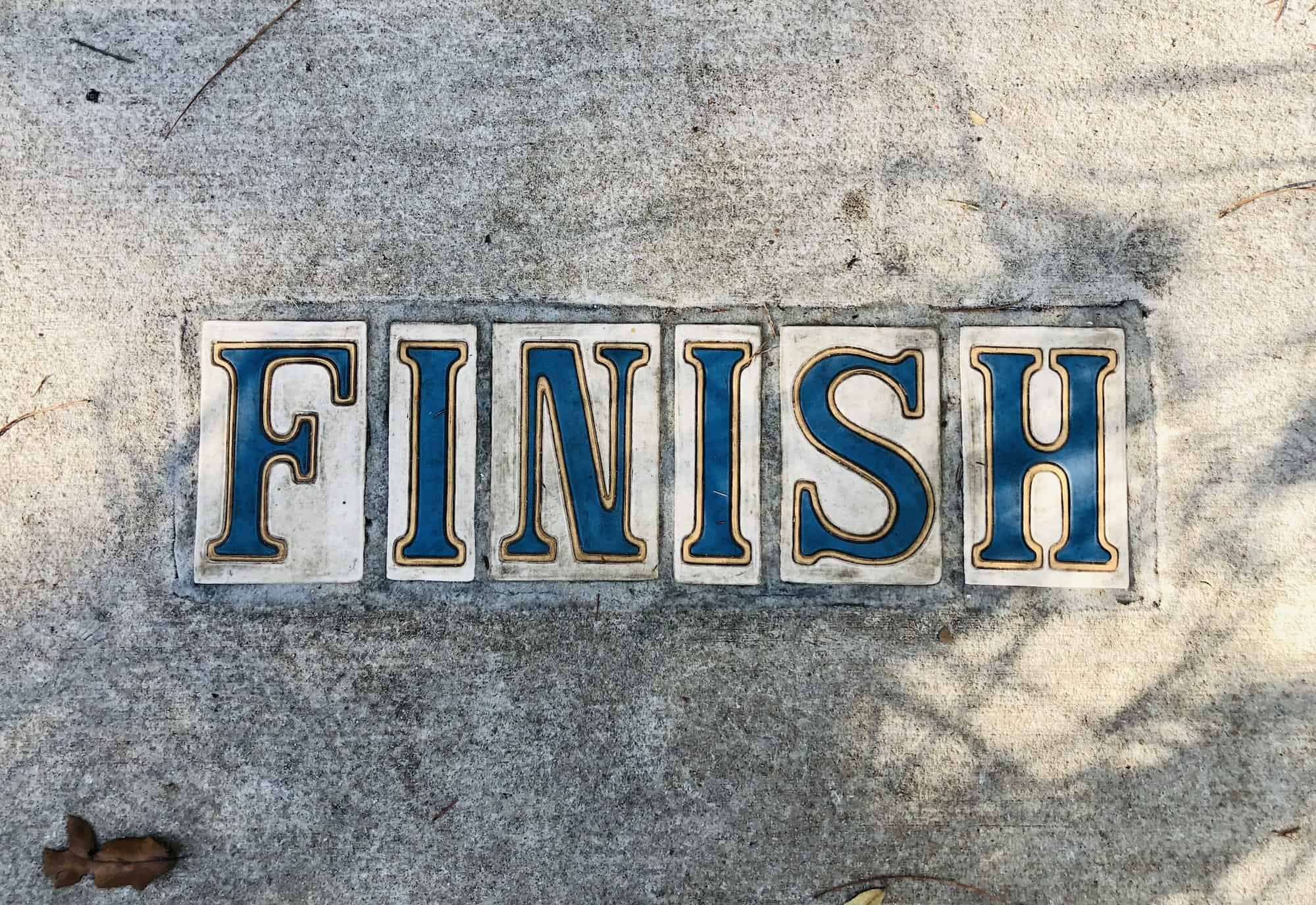 “Finish” sign in sidewalk