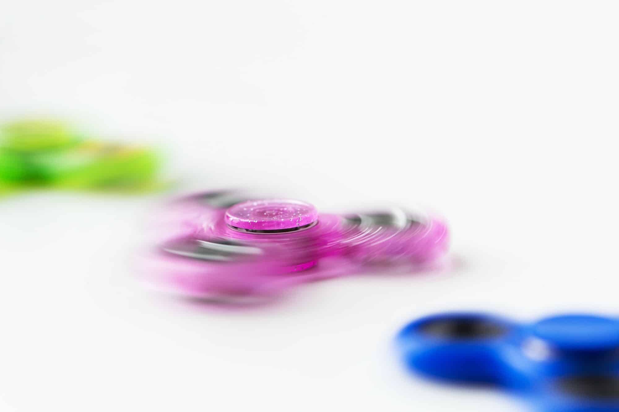 close up of spinning fidget spinners