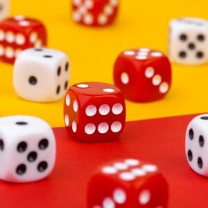 Gaming dice on color background
