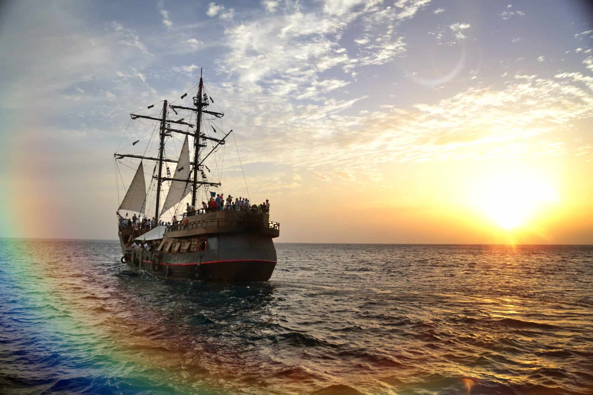 Enchanted Spanish Galleon pirate ship storybook magic sailing into sunset with fairy tale rainbow